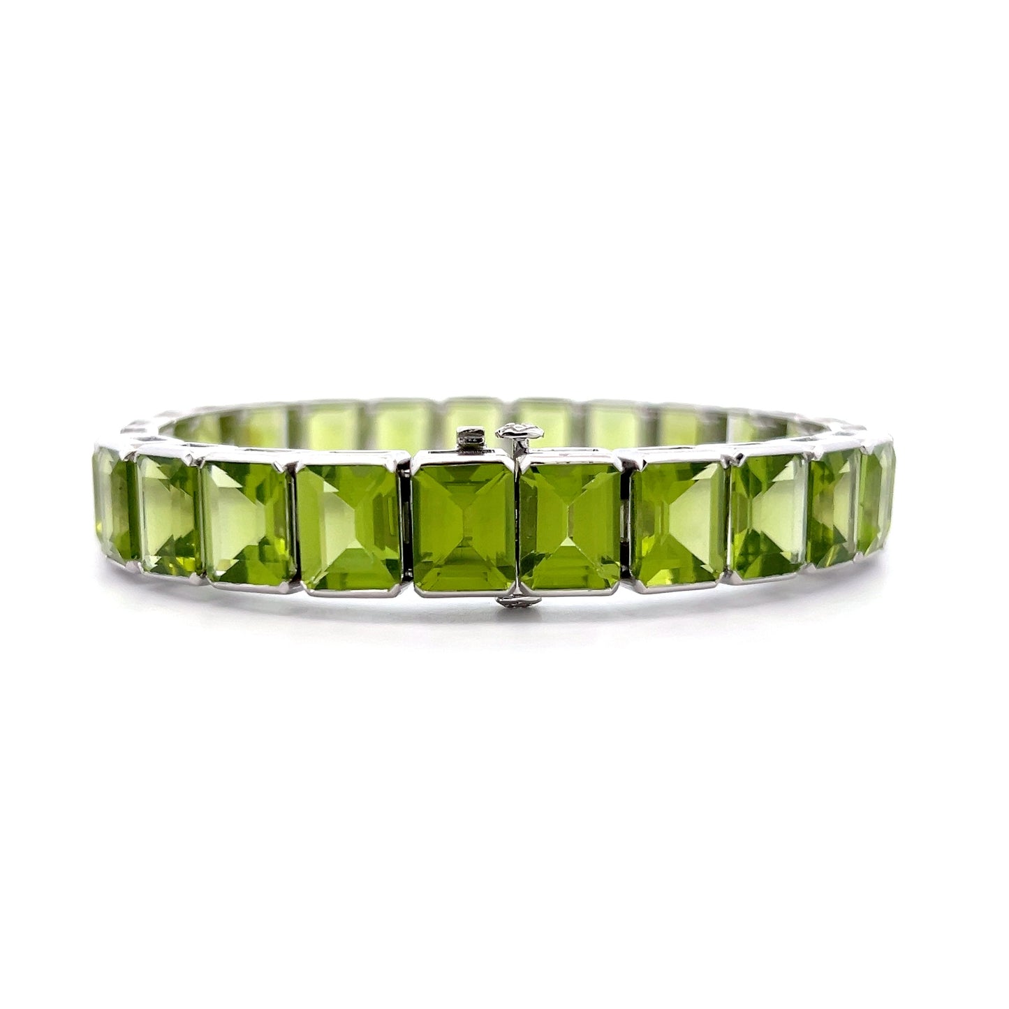 57.22 Emerald Cut Peridot Line Bracelet Platinum