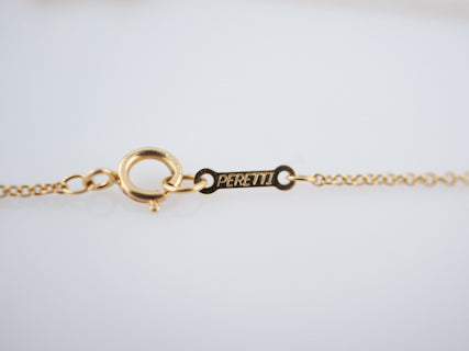 Tiffany and Co 18 karat Yellow Gold Cross Necklace Originally Designed By Elsa Perretti