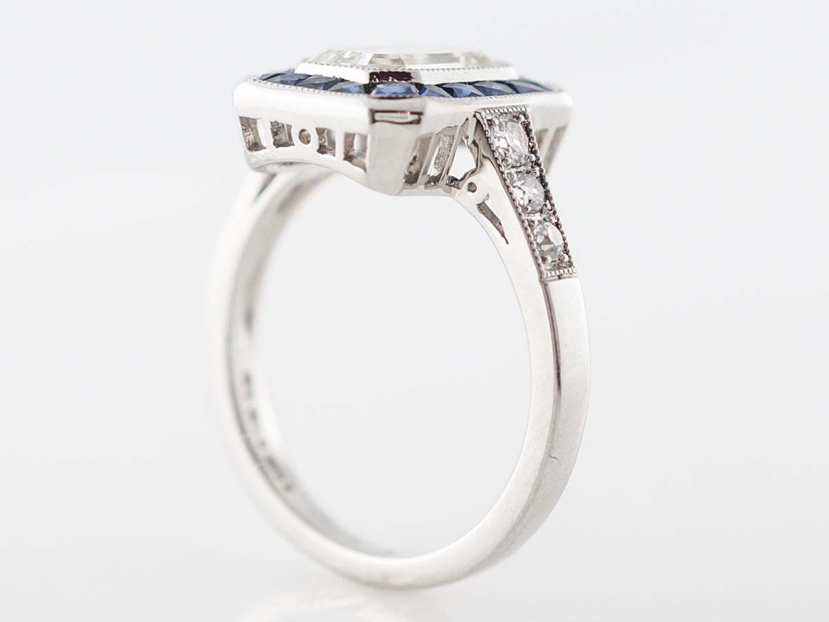 Halo Engagement Ring w/ Emerald Cut Diamond in Platinum