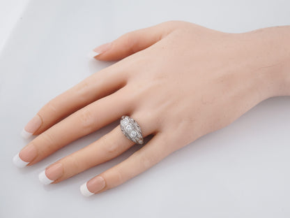Filigree Three Stone Diamond Engagement Ring in Platinum