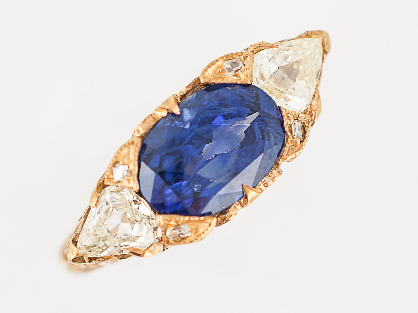 Modern Right Hand Ring 2.21 Oval Cut Sapphire & .53 Pear Cut Diamonds in 18K Yellow Gold