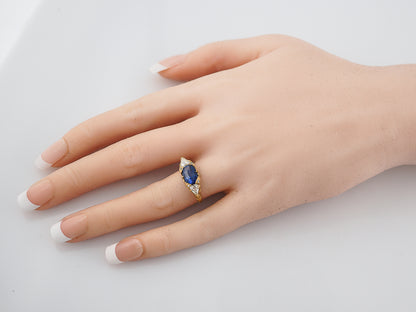 Modern Right Hand Ring 2.21 Oval Cut Sapphire & .53 Pear Cut Diamonds in 18K Yellow Gold