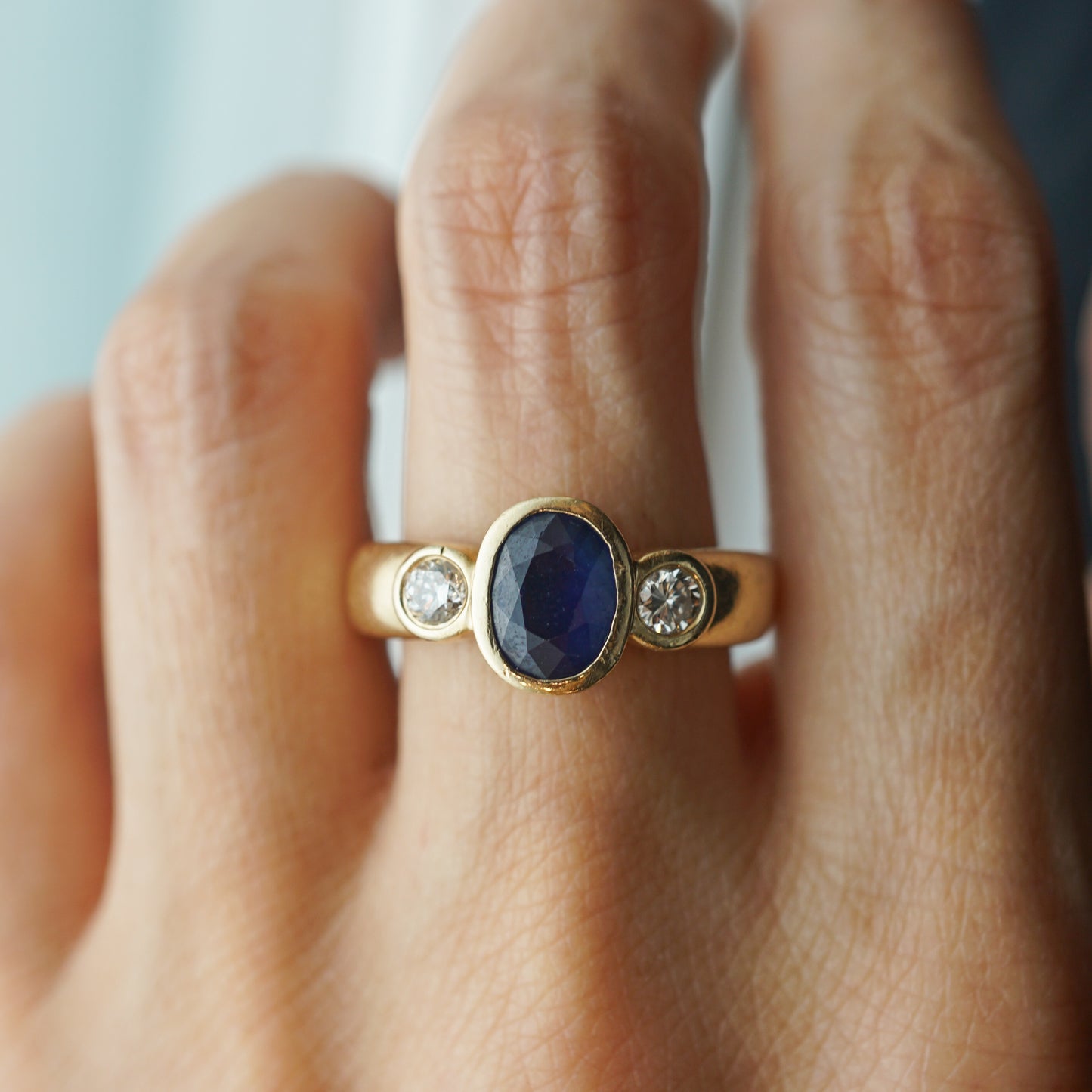 Bezel Set Oval Sapphire & Diamond Ring in 14k Yellow Gold