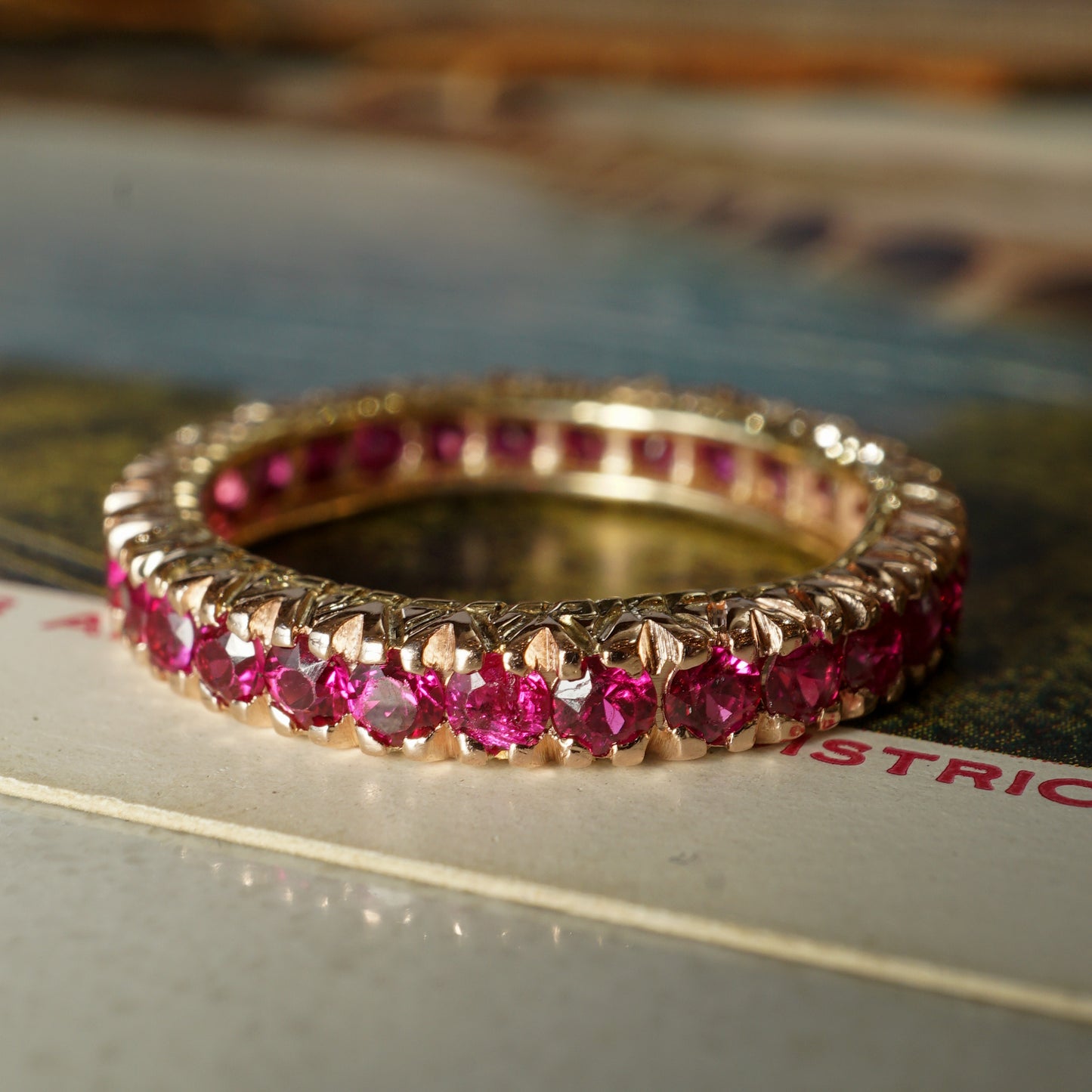 Round Cut Ruby Eternity Wedding Band in 14k Yellow Gold