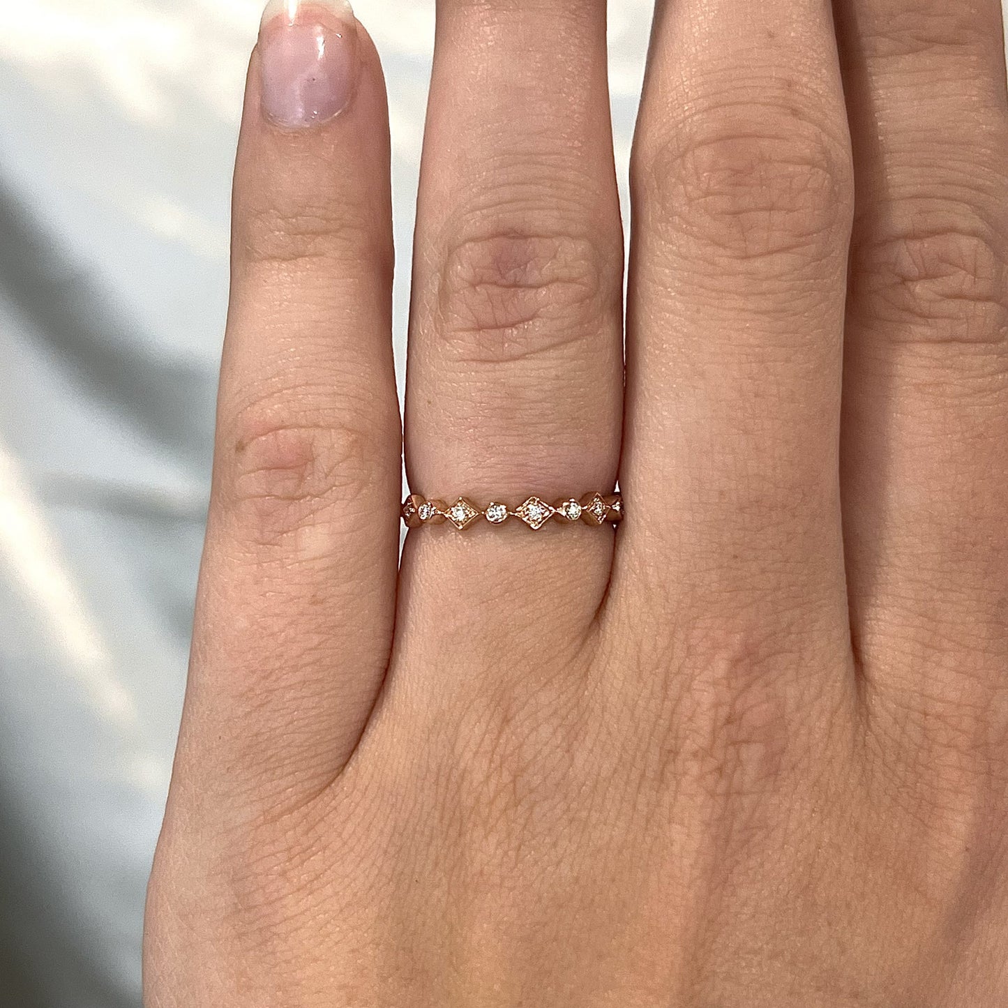 Unique Bezel Set Diamond Wedding Band in 14k Rose Gold