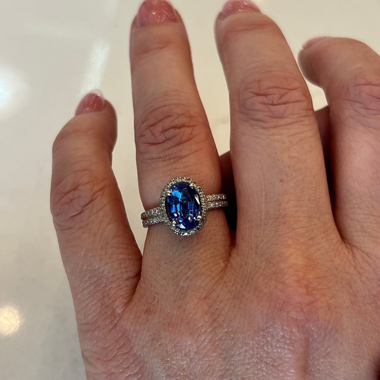 Oval Cut Tanzanite & Diamond Halo Ring in Platinum