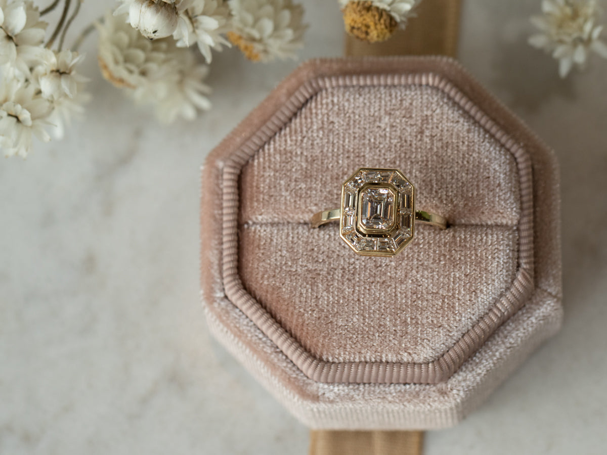 Halo Emerald Cut Diamond Engagement Ring in Yellow Gold