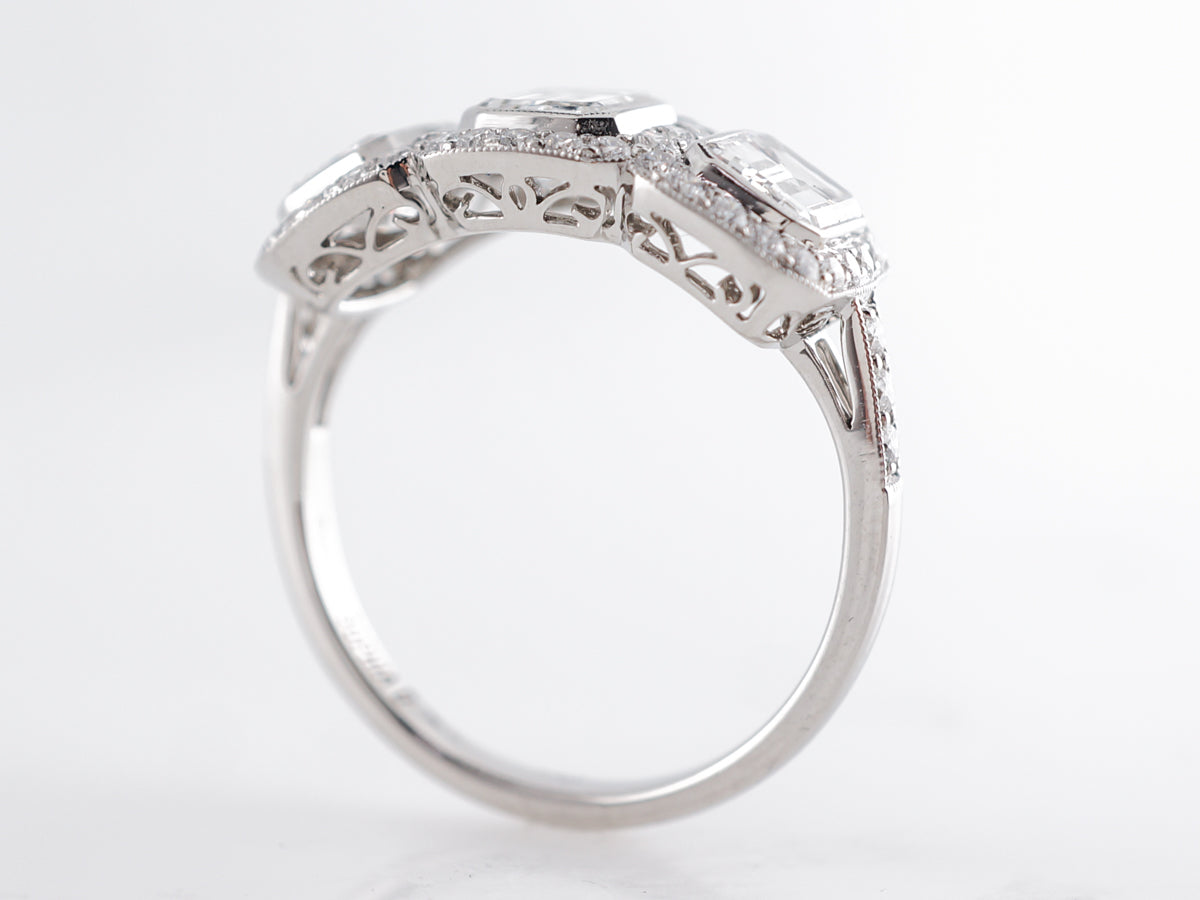 Deco Style Three Stone Emerald Cut Diamond Ring in Platinum