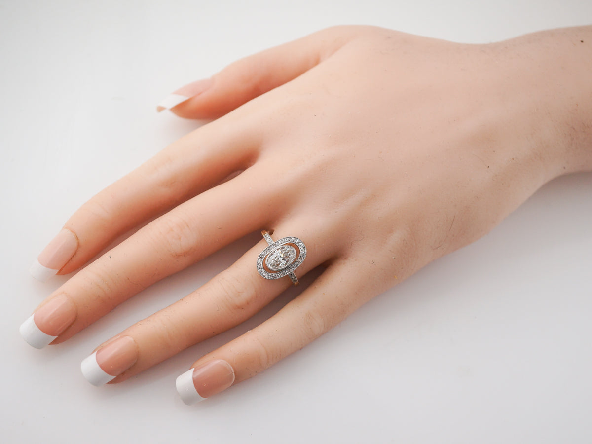 Vintage Victorian Oval Cut Diamond Halo Engagement Ring in Platinum & 14k Yellow Gold