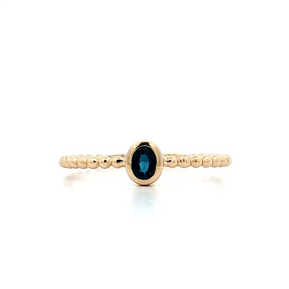 .15 Oval Blue Topaz Stacking Ring 14k Yellow Gold