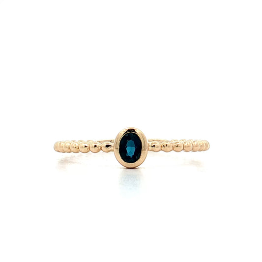 .15 Oval Blue Topaz Stacking Ring 14k Yellow Gold