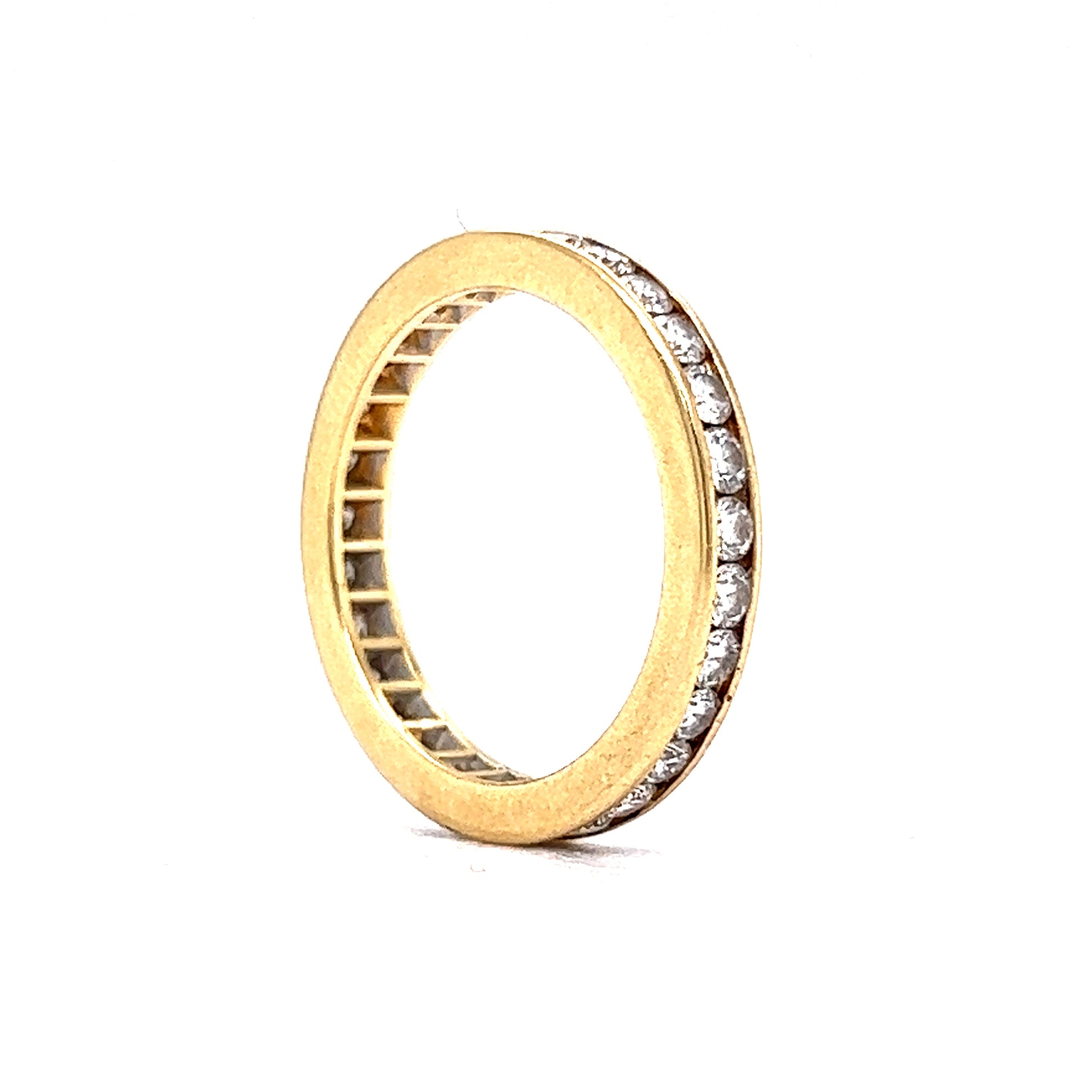 .90 Channel Set Diamond Eternity Band in 18k Yellow GoldComposition: 18 Karat Yellow GoldRing Size: 6Total Diamond Weight: .90 ctTotal Gram Weight: 3.3 gInscription: SBI 18K