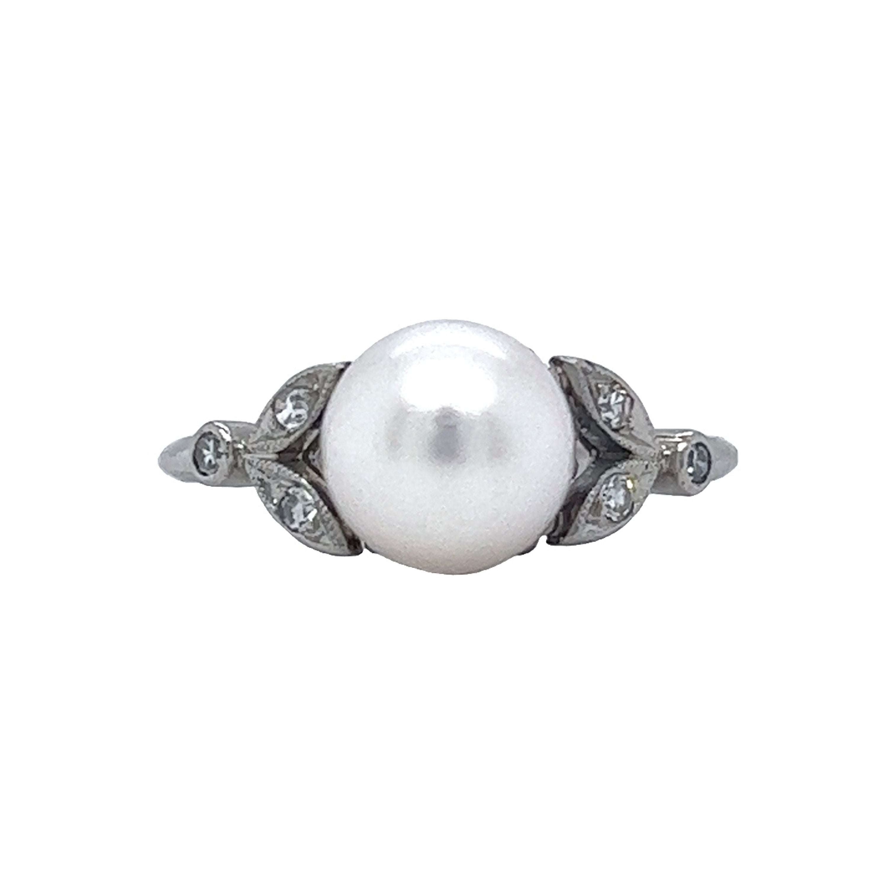 Platinum plated cz ring with big pearl centre -