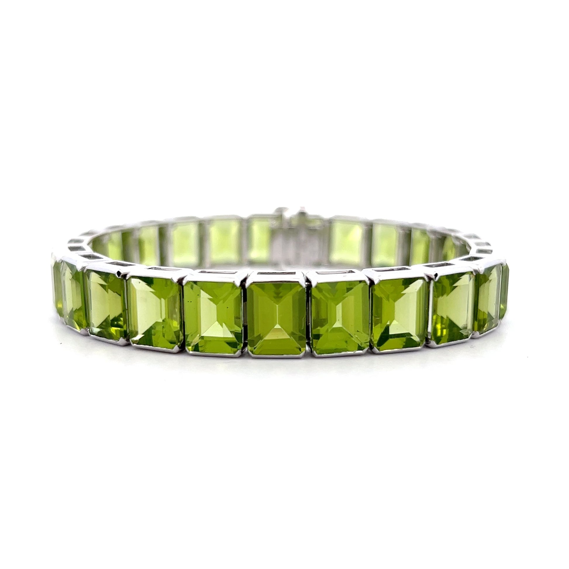 57.22 Emerald Cut Peridot Line Bracelet Platinum