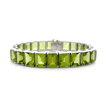 57.22 Emerald Cut Peridot Line Bracelet Platinum