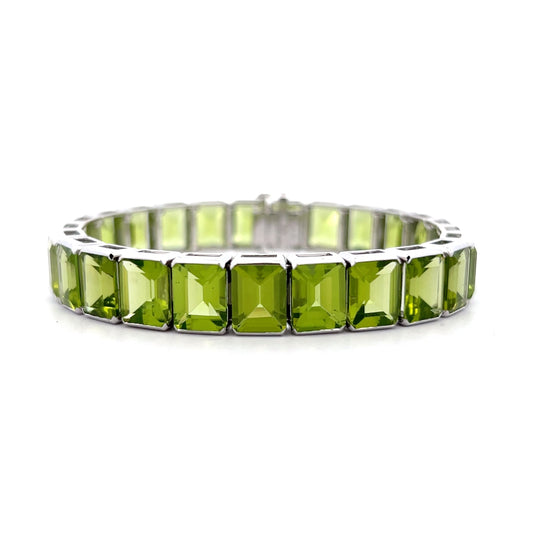 57.22 Emerald Cut Peridot Line Bracelet Platinum