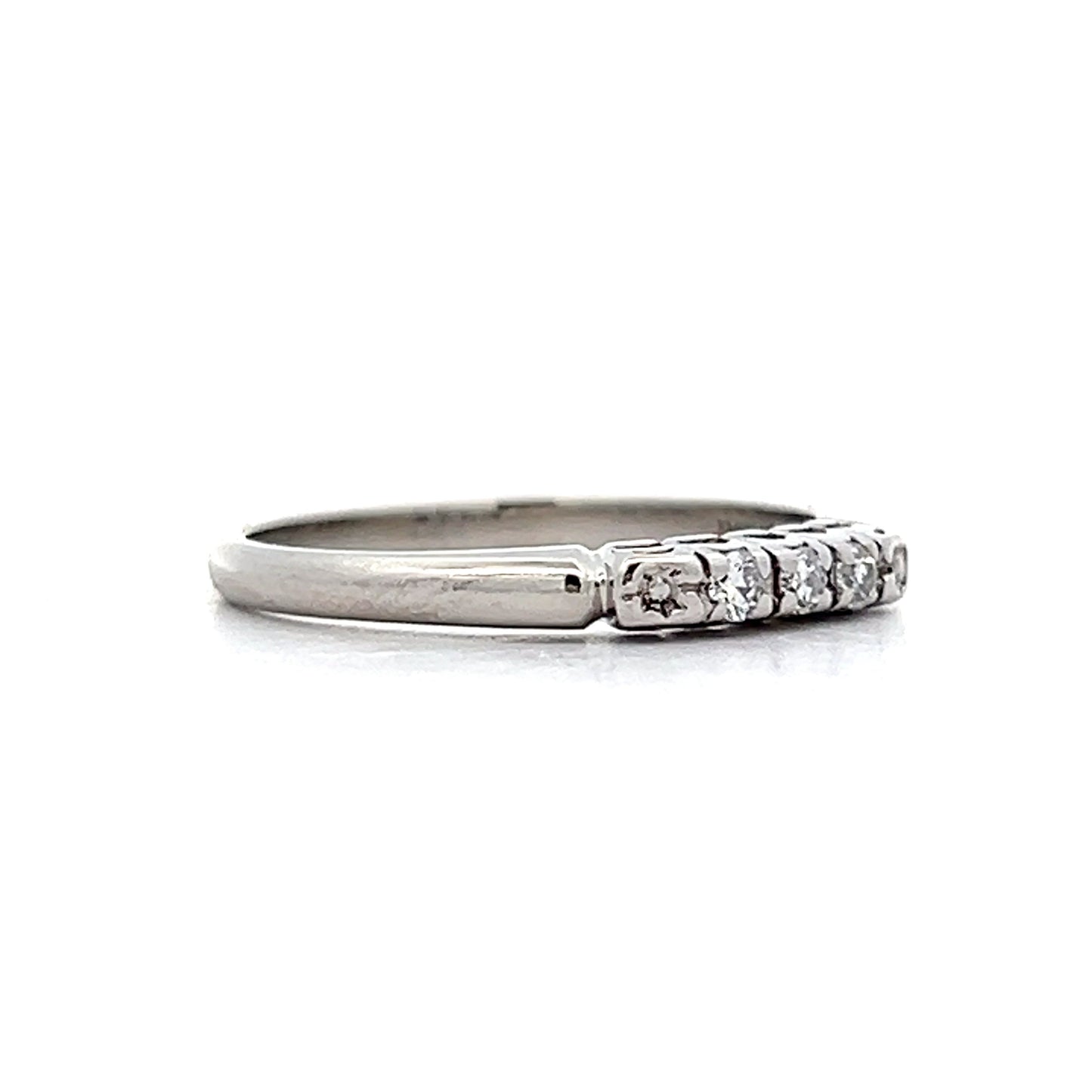 .09 Vintage Mid-Century Three Stone Band in Platinum