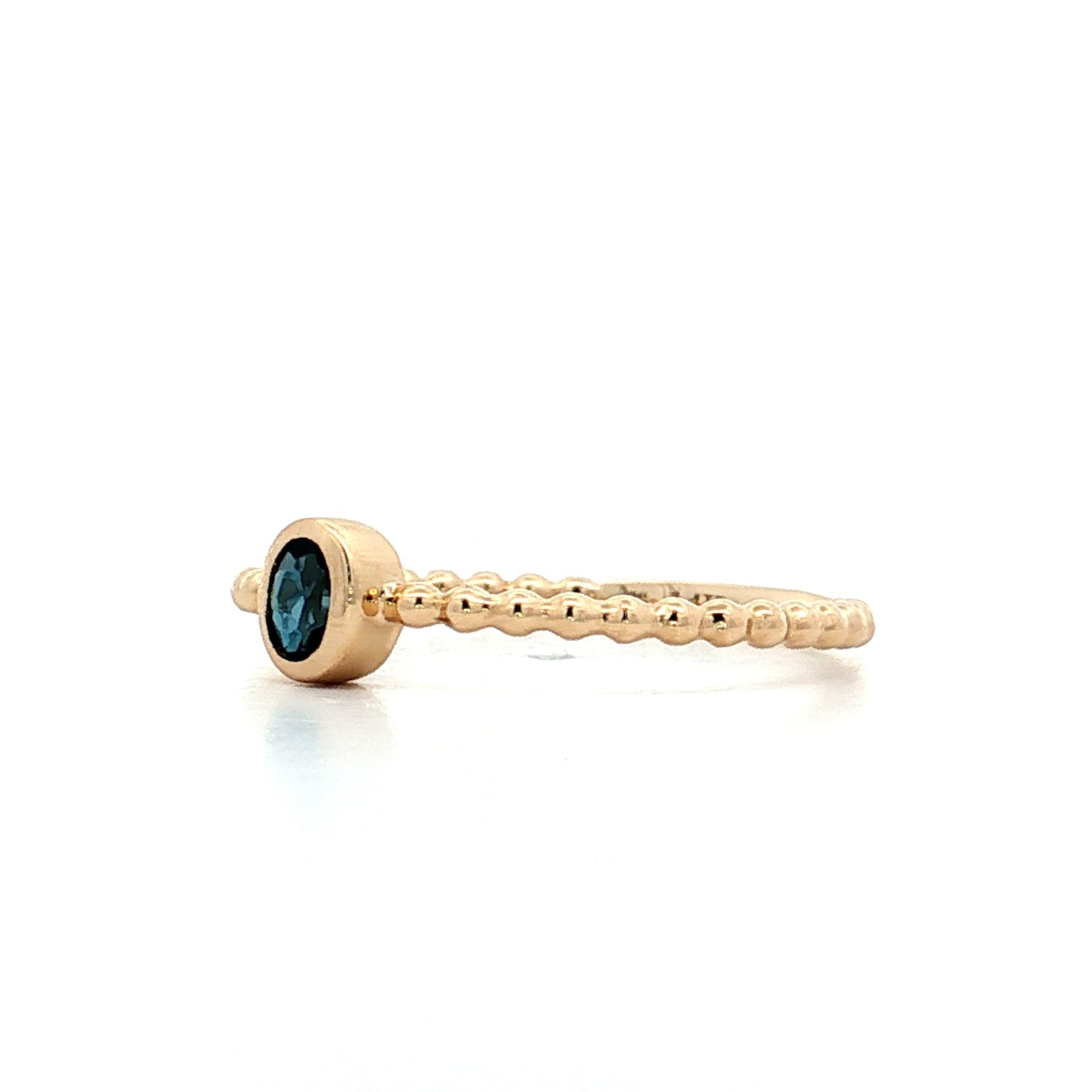 .15 Oval Blue Topaz Stacking Ring 14k Yellow Gold