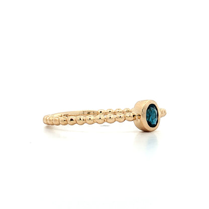 .15 Oval Blue Topaz Stacking Ring 14k Yellow Gold