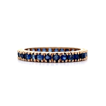 Round Cut Sapphire Eternity Wedding Band in 14k Yellow Gold