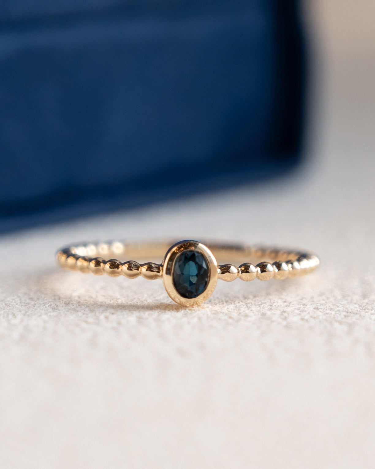 .15 Oval Blue Topaz Stacking Ring 14k Yellow Gold