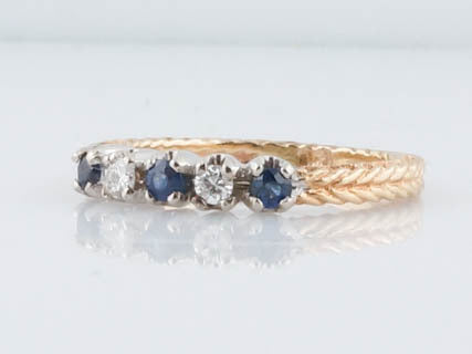 Modern Five Stone Diamond and Sapphire Cocktail Ring in 14k Yellow GoldComposition: 14 Karat Yellow Gold Total Diamond Weight: .14ct Total Gram Weight: 3.52 g