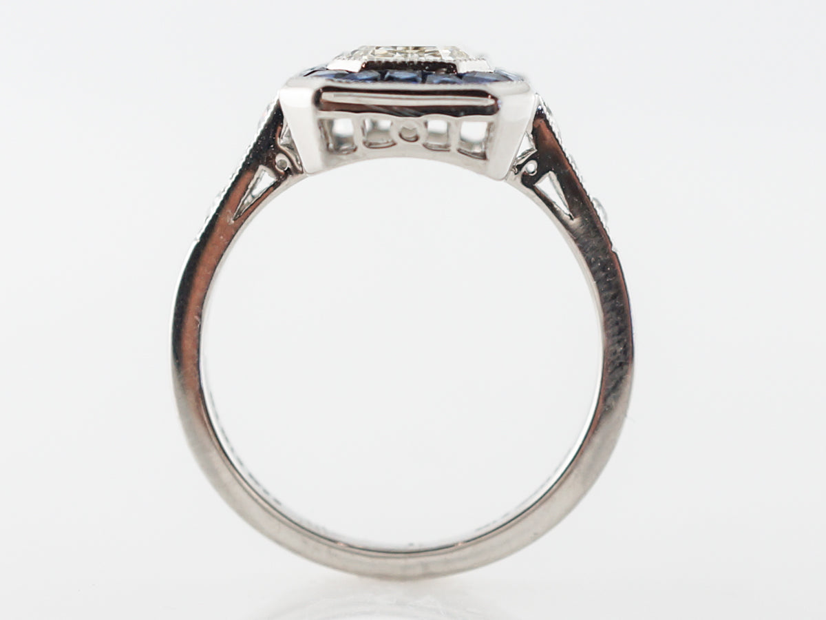 Halo Engagement Ring w/ Emerald Cut Diamond in Platinum