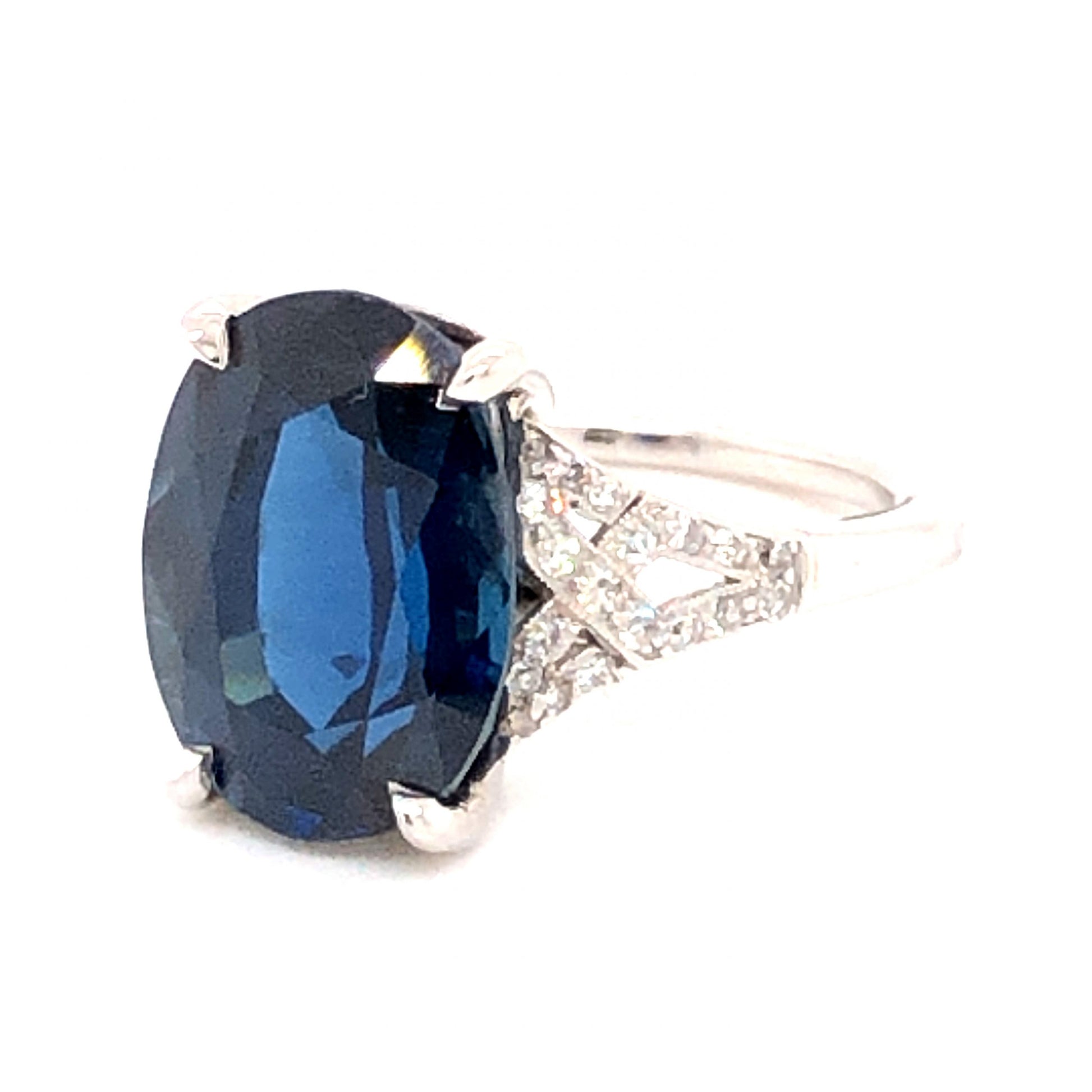 Vintage 6.90 Oval Cut Sapphire w/ Diamonds in PlatinumComposition: Platinum Ring Size: 4.75 Total Diamond Weight: .38ct Total Gram Weight: 5.5 g
