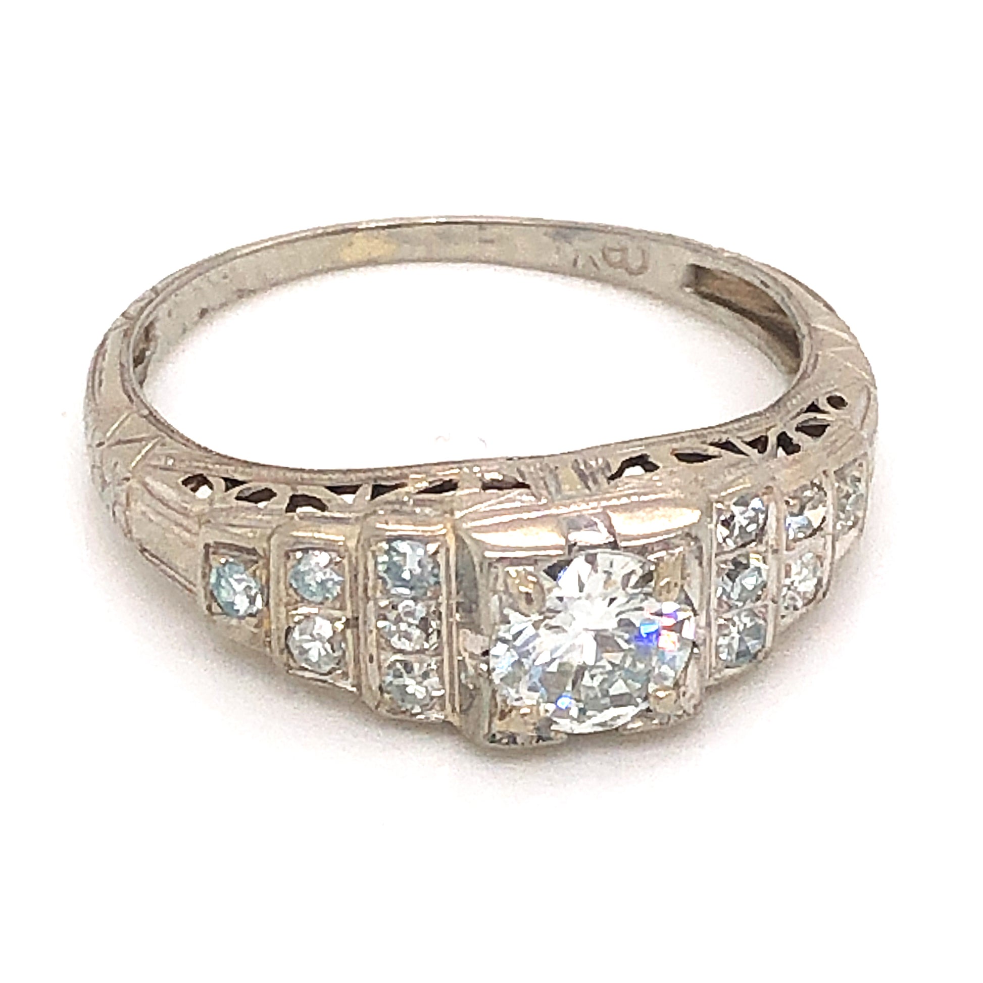 .55 Art Deco Diamond Engagement Ring in 18K White GoldComposition: 18 Karat White Gold Ring Size: 7 Total Diamond Weight: .97ct Total Gram Weight: 2.4 g