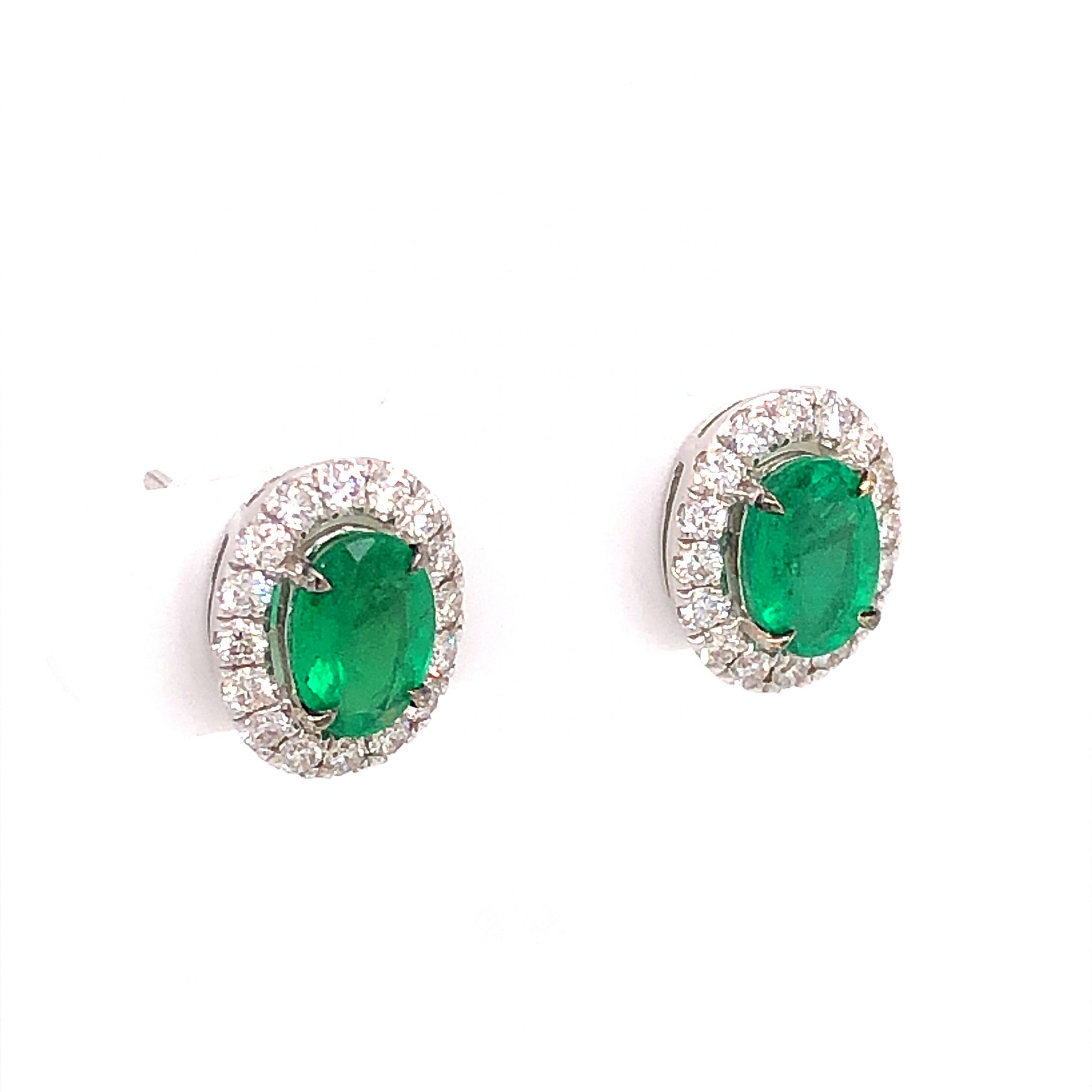 1.14 Oval Cut Emerald & Diamond Stud Earrings in 18k White GoldComposition: 18 Karat White Gold Total Diamond Weight: .48ct Total Gram Weight: 3.7 g Inscription: 18K 750
      