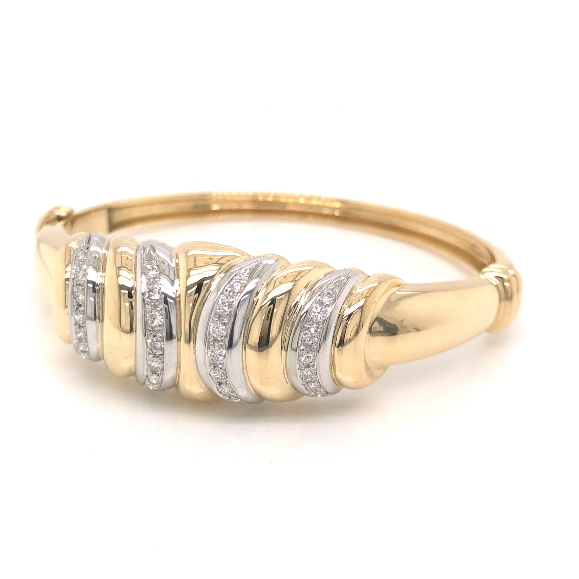 .56 Modern Diamond Bangle Bracelet in 18k GoldComposition: 18 Karat White Gold/18 Karat Yellow GoldTotal Diamond Weight: .56 ctTotal Gram Weight: 37.0 gInscription: 750