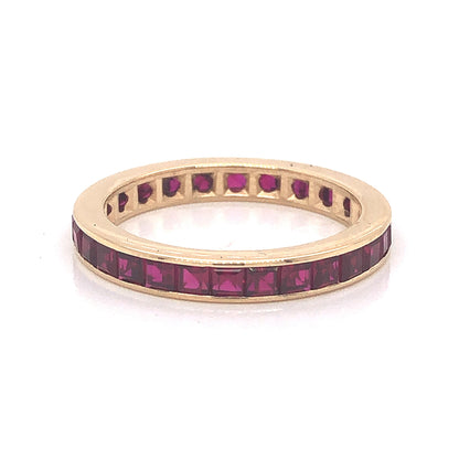 Channel Set Ruby Eternity Wedding Band in 14k Yellow Gold