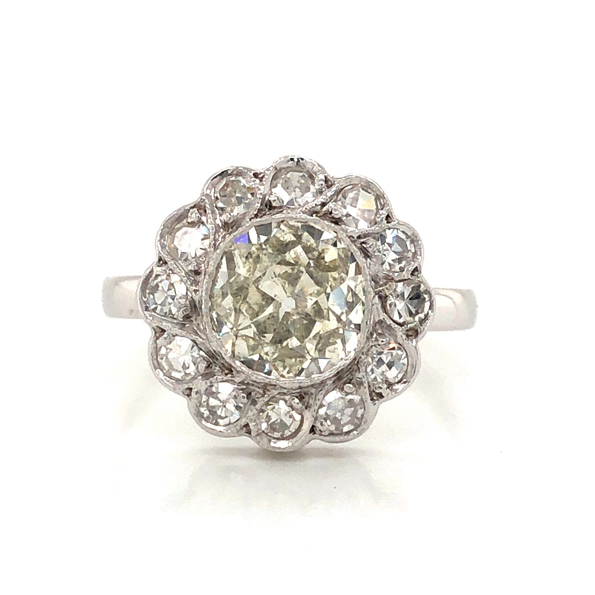 Art Deco Floral Diamond Cluster Engagement Ring in 14k White GoldComposition: 14 Karat White Gold Ring Size: 6 Total Diamond Weight: 1.48ct Total Gram Weight: 2.4 g