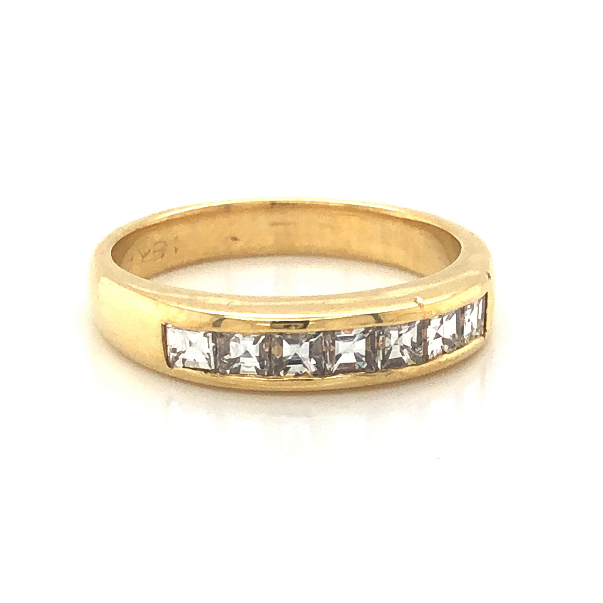 Square Step Cut Diamond Wedding Band in 18k Yellow GoldComposition: PlatinumRing Size: 5.5Total Diamond Weight: .63 ctTotal Gram Weight: 4.0 gInscription: 18k 