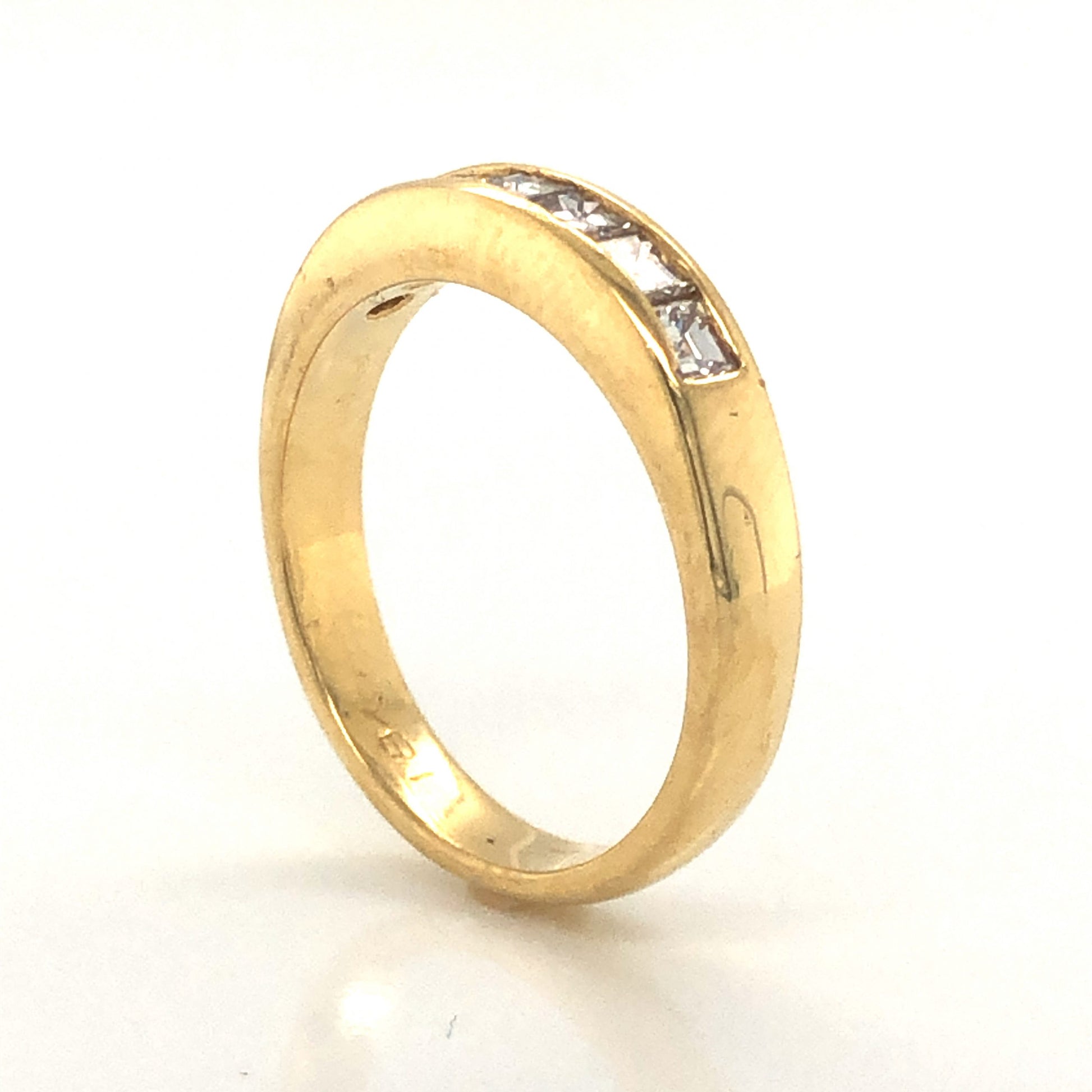Square Step Cut Diamond Wedding Band in 18k Yellow GoldComposition: PlatinumRing Size: 5.5Total Diamond Weight: .63 ctTotal Gram Weight: 4.0 gInscription: 18k 