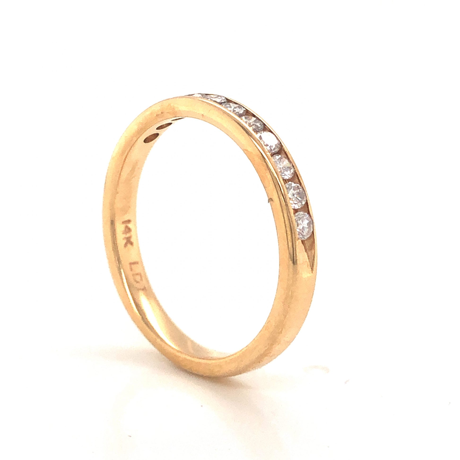 .33 Channel Set Diamond Wedding Band in 14k Yellow GoldComposition: 14 Karat Yellow Gold Ring Size: 7 Total Diamond Weight: .33ct Total Gram Weight: 2.2 g Inscription: 14k LDT
      