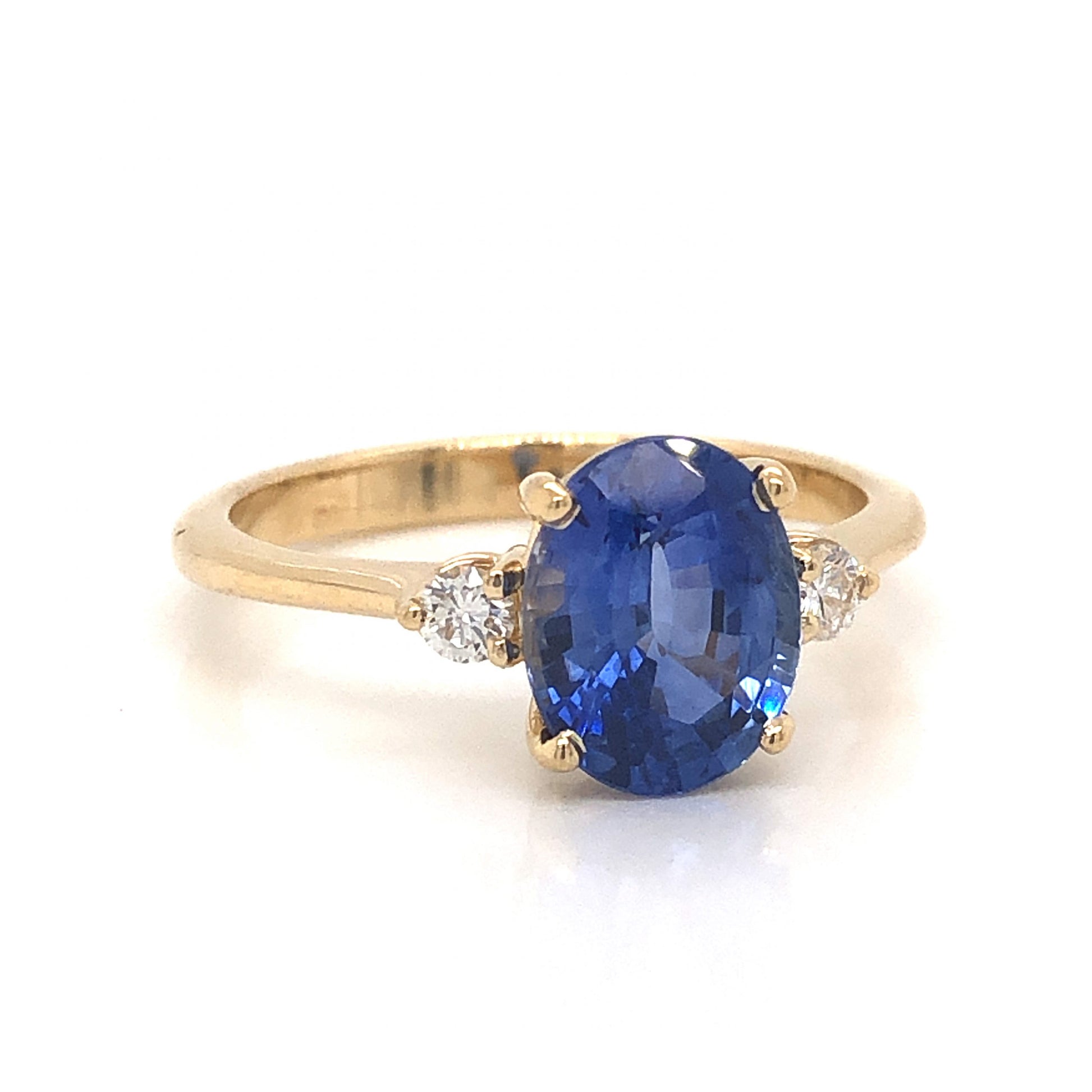 2.23 Oval Cut Sapphire Engagement Ring in Yellow GoldComposition: 14 Karat Yellow Gold Ring Size: 6.75 Total Diamond Weight: .12ct Total Gram Weight: 3.0 g Inscription: 14k
      