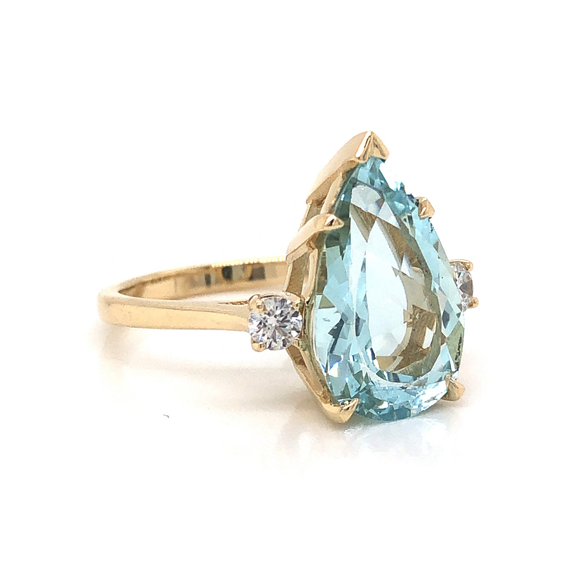 Pear Cut Aquamarine Engagement Ring in 14k Yellow GoldComposition: 14 Karat Yellow GoldRing Size: 6.75Total Diamond Weight: .18 ctTotal Gram Weight: 4.7 gInscription: 14K