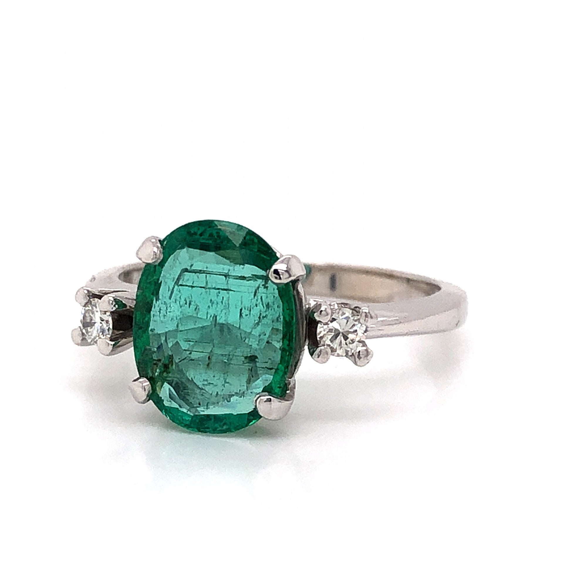 Modern Oval Cut Emerald Ring in 14k White Gold