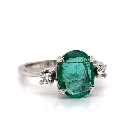 Modern Oval Cut Emerald Ring in 14k White Gold