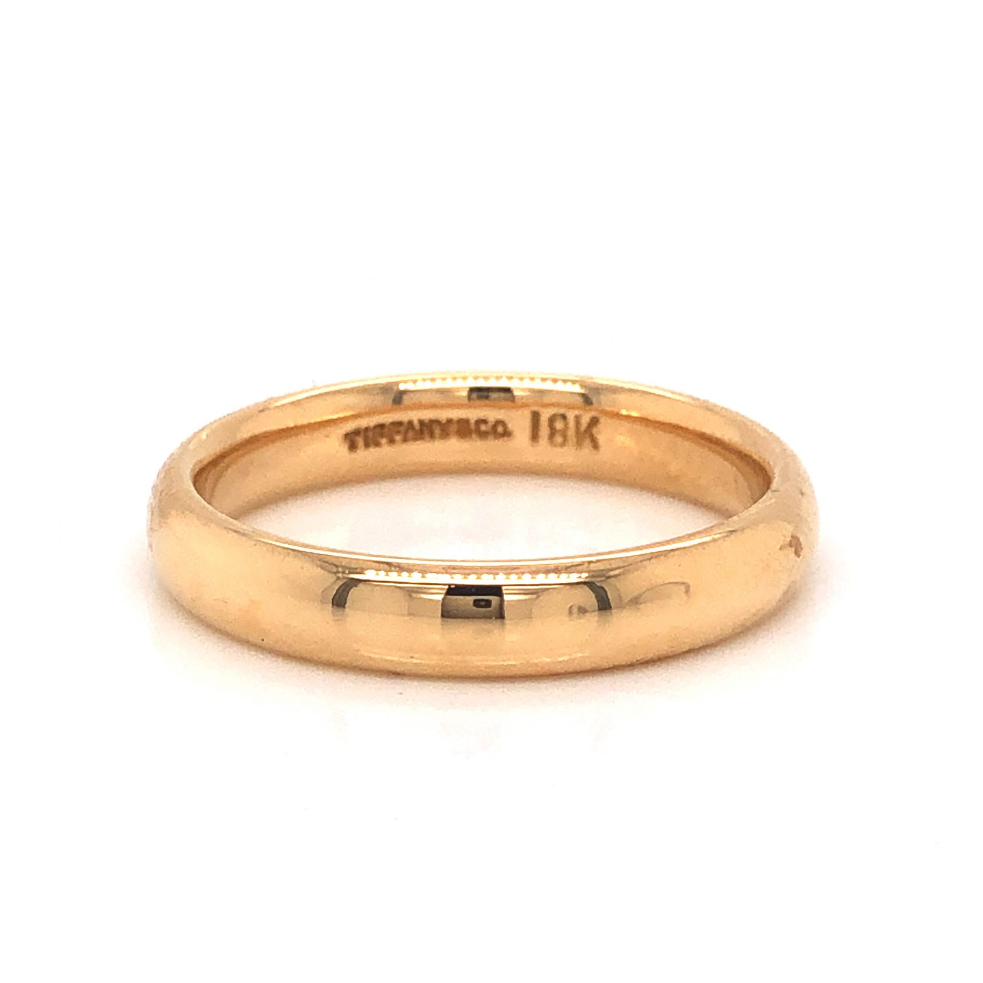 Tiffany & Co. Modern Wedding Band in 18k Yellow GoldComposition: 18 Karat Yellow GoldRing Size: 6.75Total Gram Weight: 4.8 gInscription: Tiffany & Co. 18k