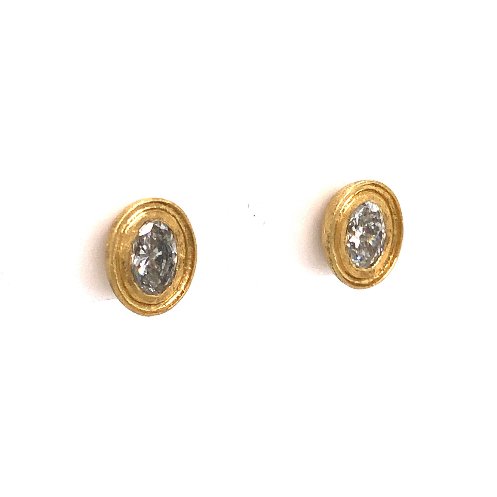 Bezel Set Oval Cut Diamond Stud Earrings in 18k Yellow GoldComposition: 18 Karat Yellow Gold Total Diamond Weight: .61ct Total Gram Weight: 3.0 g Inscription: 750
      