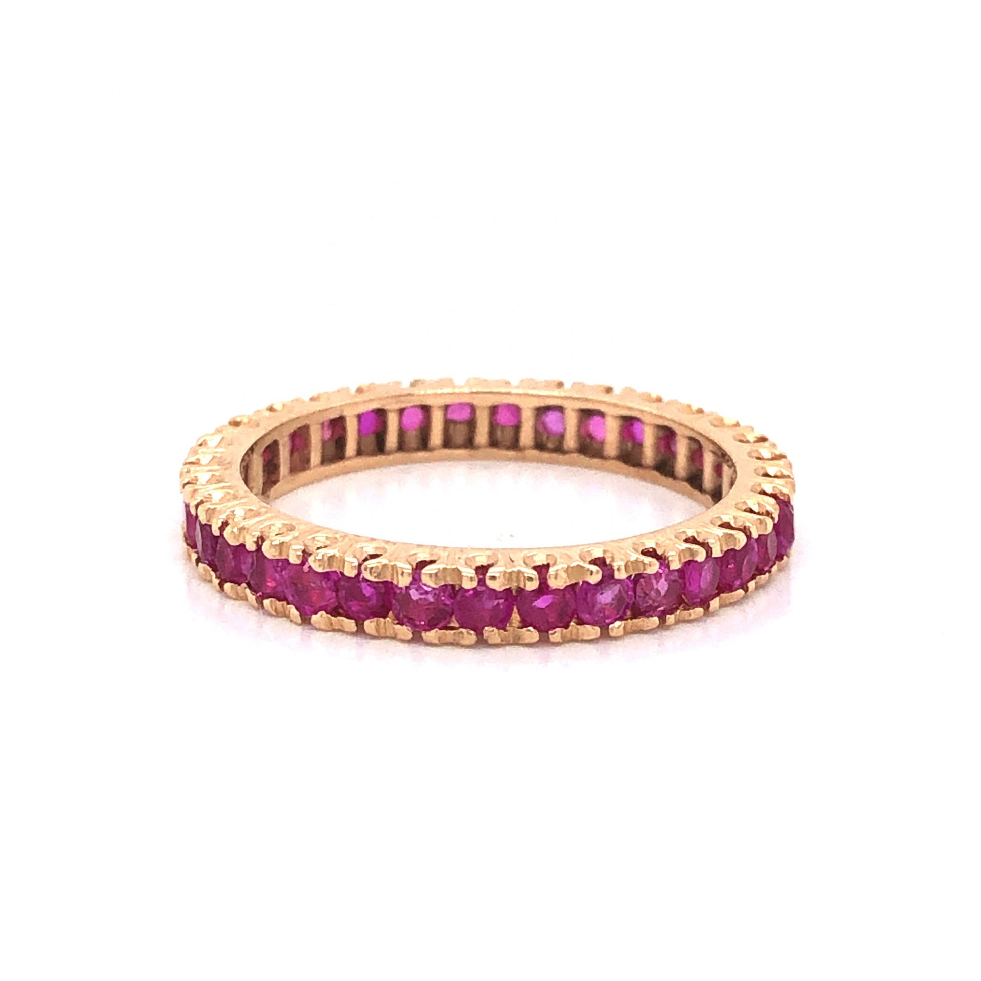 Modern Round Cut Ruby Eternity Wedding Band in 14k Yellow GoldComposition: 14 Karat Yellow Gold Ring Size: 7 Total Gram Weight: 2.4 g