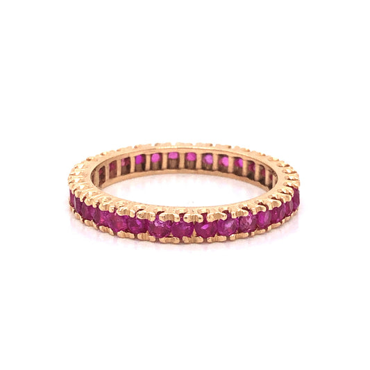 Modern Round Cut Ruby Eternity Wedding Band in 14k Yellow Gold