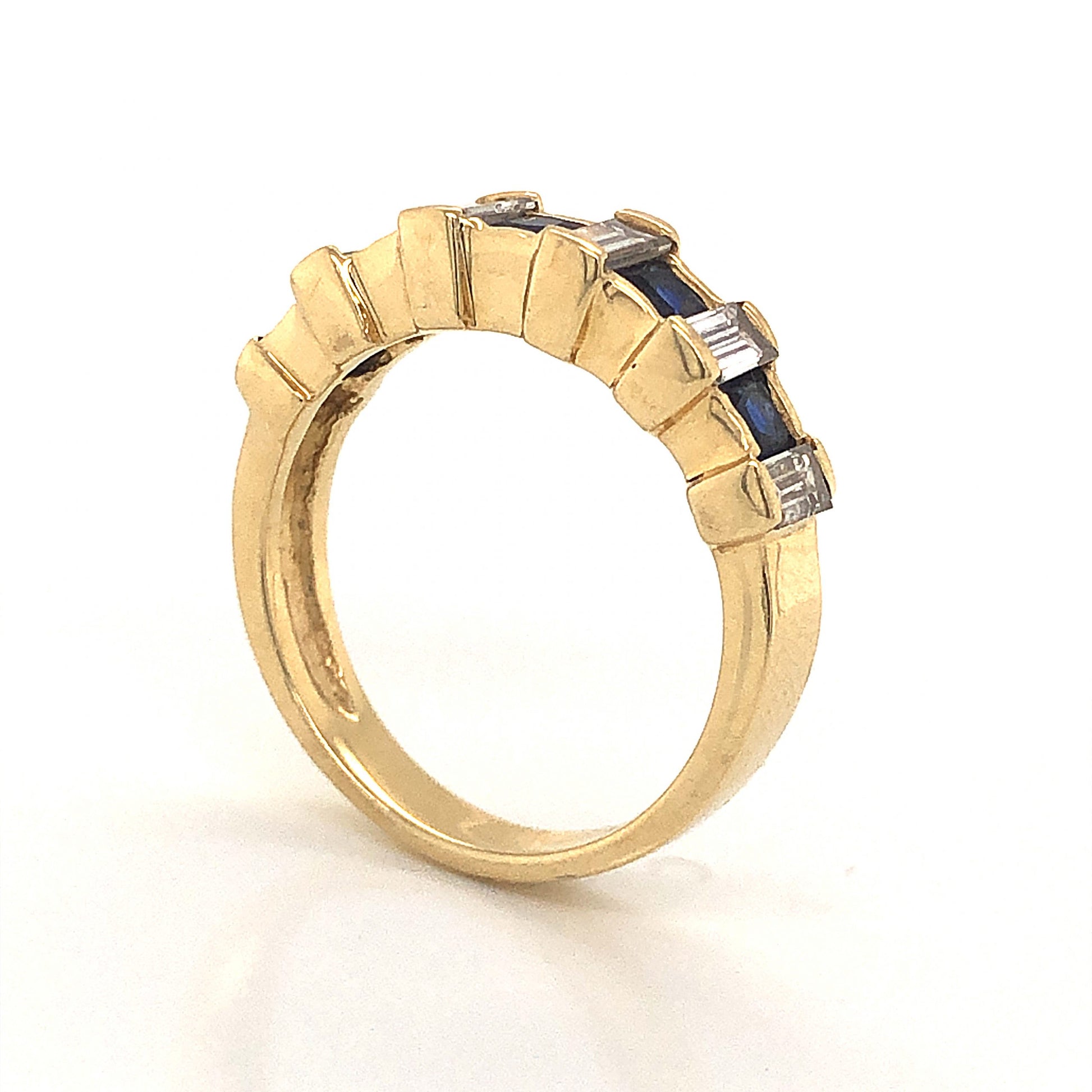 Sapphire & Baguette Diamond Wedding Band in 14k Yellow GoldComposition: 14 Karat Yellow Gold Ring Size: 5.75 Total Diamond Weight: .84ct Total Gram Weight: 3.8 g Inscription: 14k
      