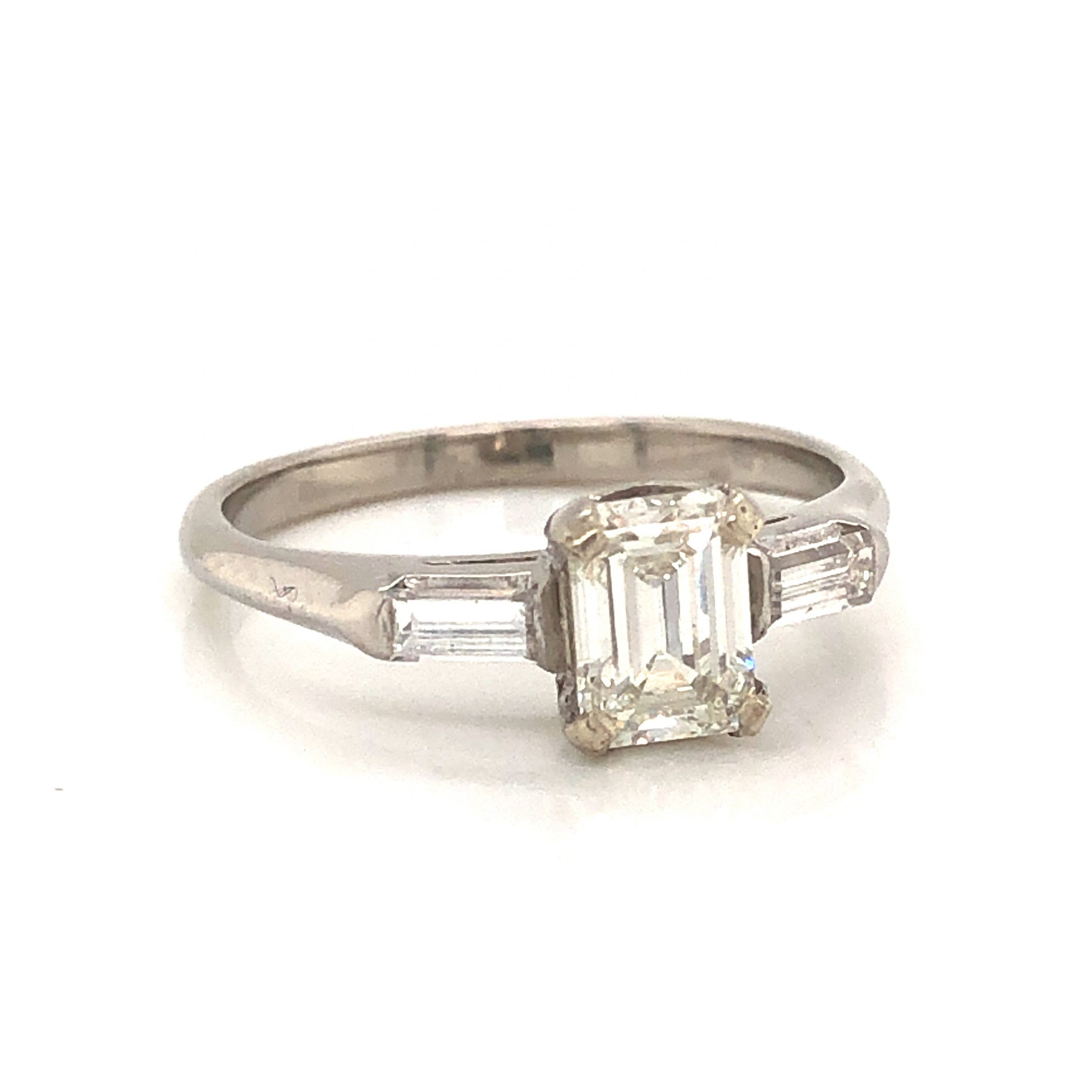 Vintage .63 Emerald Cut Diamond Engagement Ring in PlatinumComposition: PlatinumRing Size: 5.5Total Diamond Weight: .93 ctTotal Gram Weight: 3.5 gInscription: 90