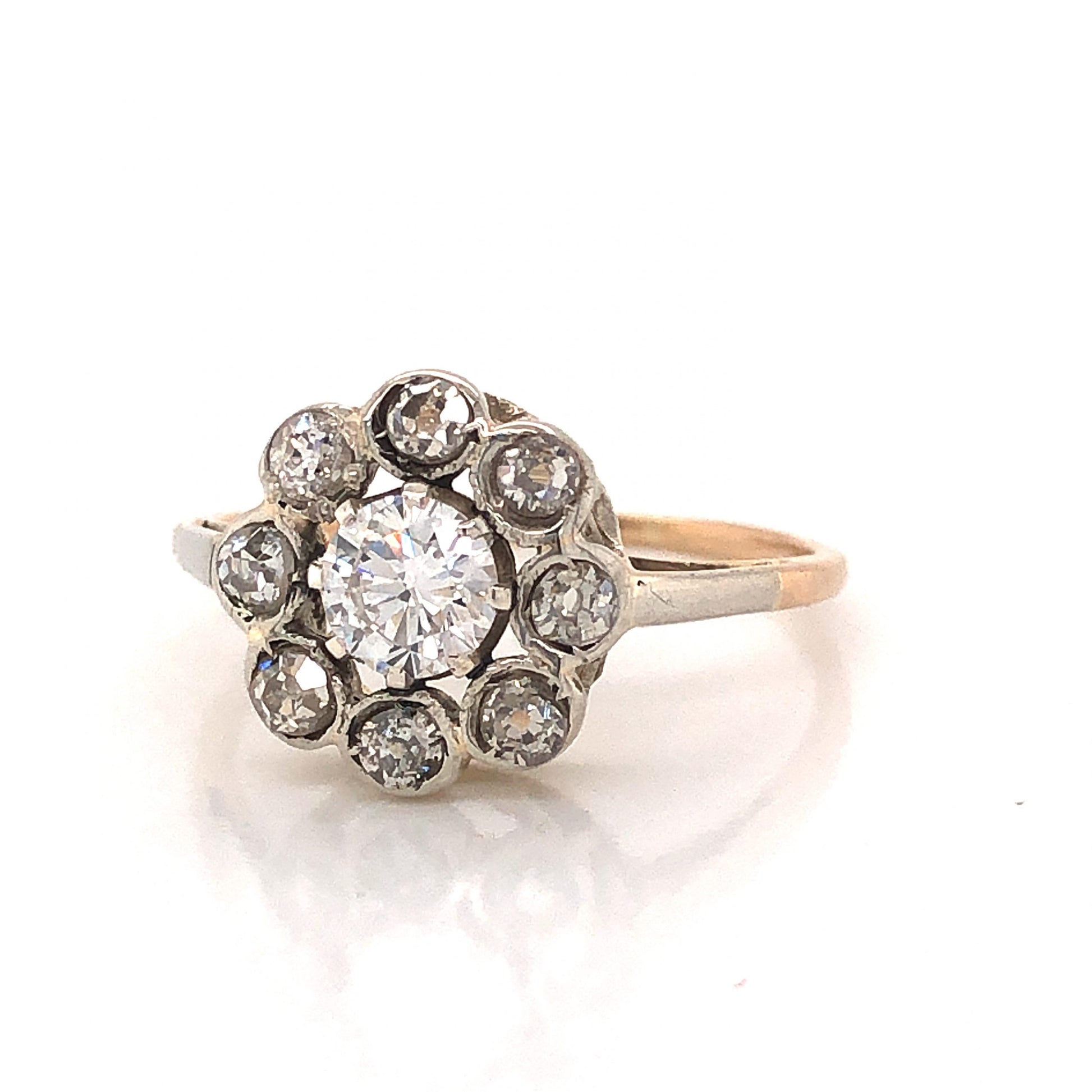 Victorian Bezel Set Diamond Cluster Engagement Ring in Silver & 14kComposition: Sterling Silver/14 Karat Yellow Gold Ring Size: 6 Total Diamond Weight: .78ct Total Gram Weight: 1.8 g