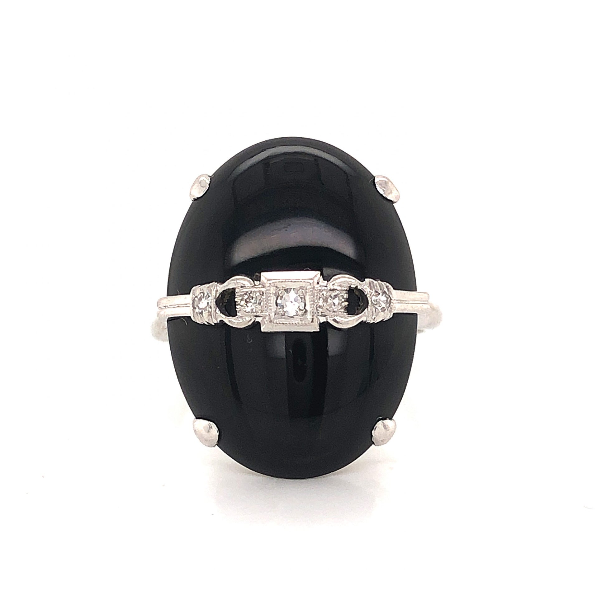 Art Deco Oval Onyx and Diamond Ring in 14k White GoldComposition: 14 Karat White Gold Ring Size: 7.5 Total Diamond Weight: .07ct Total Gram Weight: 5.2 g Inscription: 14
      
