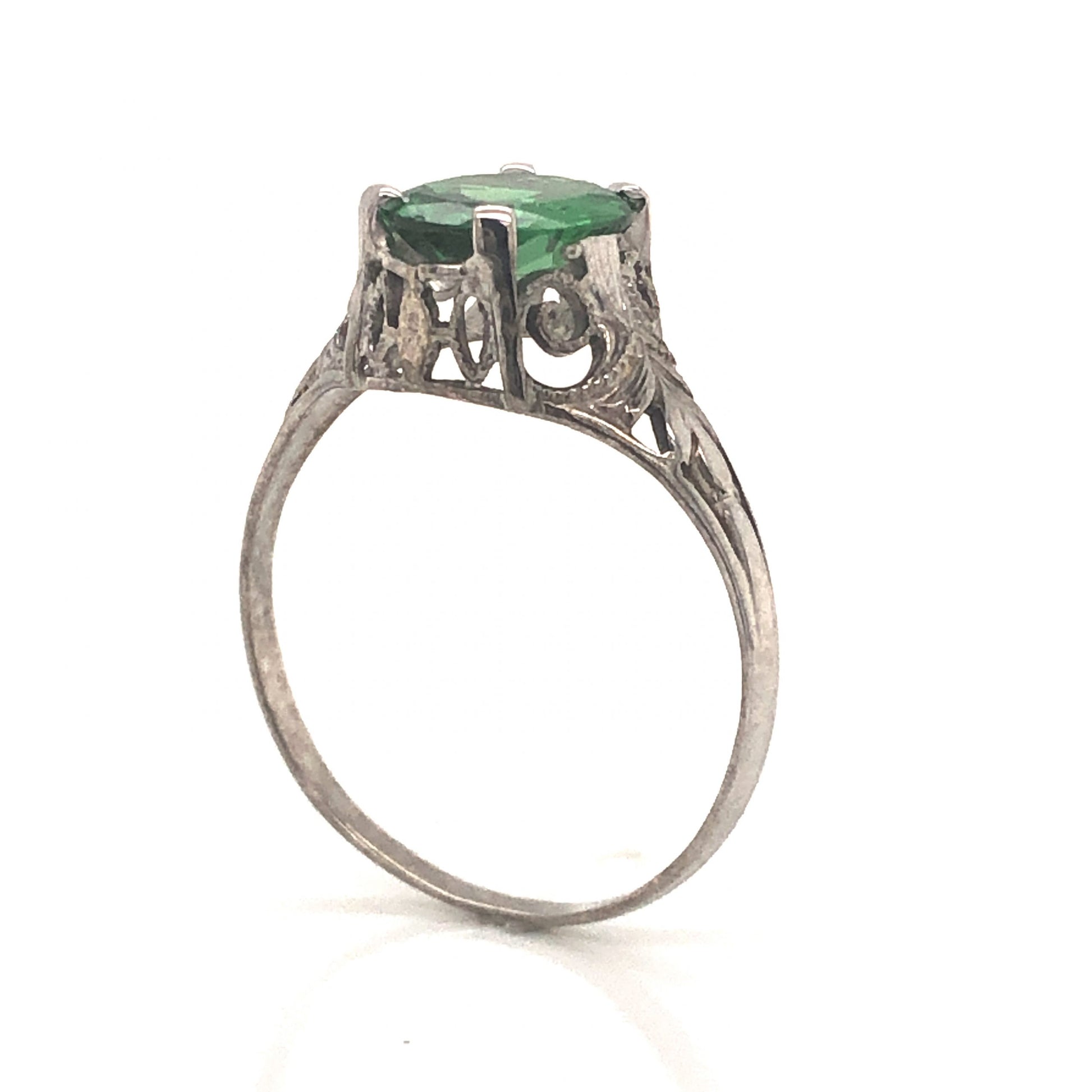 Art Deco Tsavorite Garnet Engagement Ring in 18k White GoldComposition: 18 Karat White Gold Ring Size: 7 Total Gram Weight: 2.0 g Inscription: 18kt
      