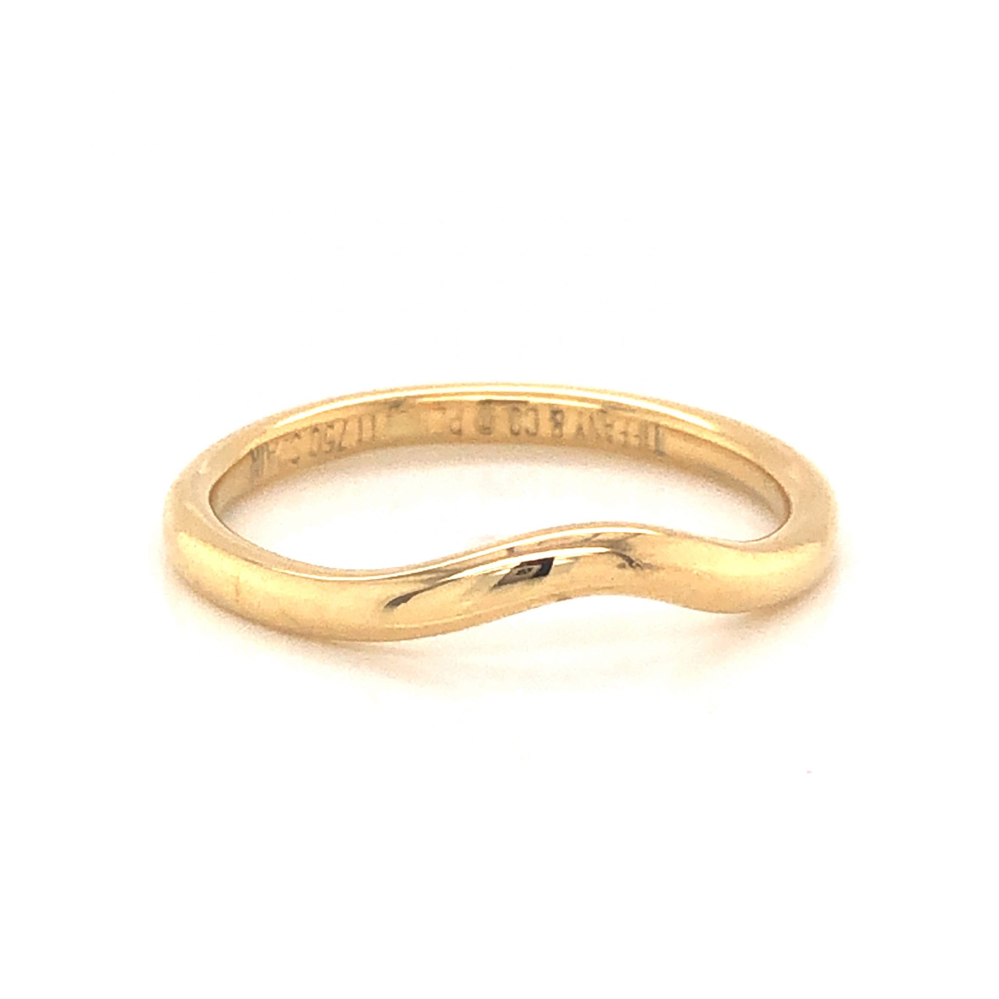 Tiffany & Co. Contoured Wedding Band in 18k Yellow GoldComposition: 18 Karat Yellow GoldRing Size: 5Total Gram Weight: 2.1 gInscription: Tiffany & Co. PERETTI 750 SPAIN